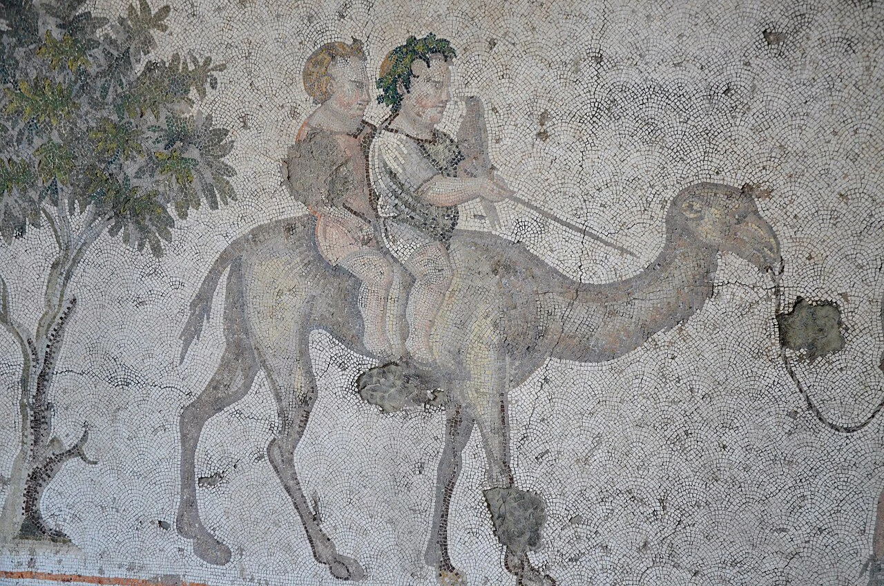 Children riding a camel in a Great Palace mosaic.