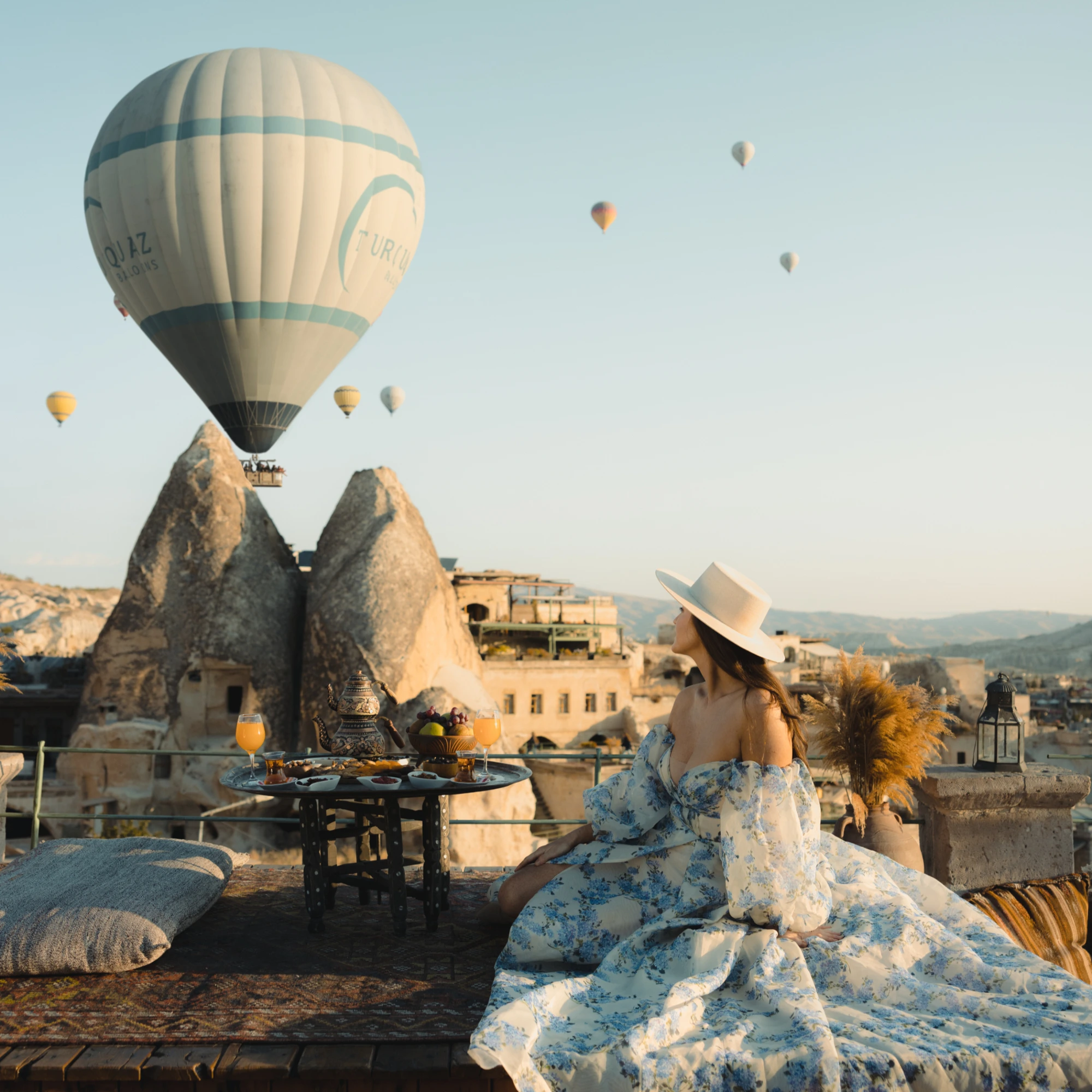 Sultan Cave Suites rooftop overlooking Göreme with hot-air balloons